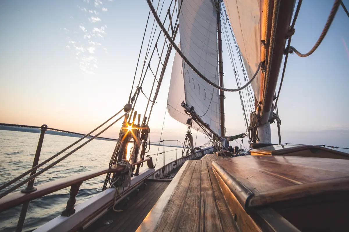 The deck of a tall sailing ship at sunset